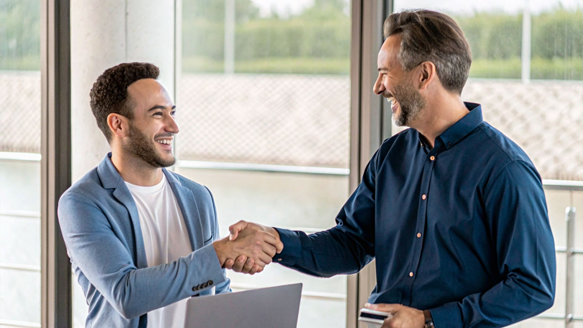 Two men shaking hands.